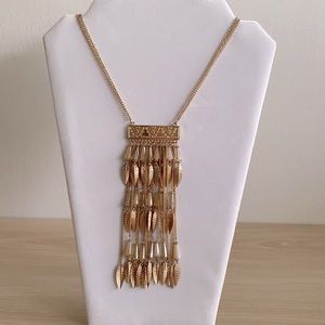Vintage Golden long necklace with feather details an beads.